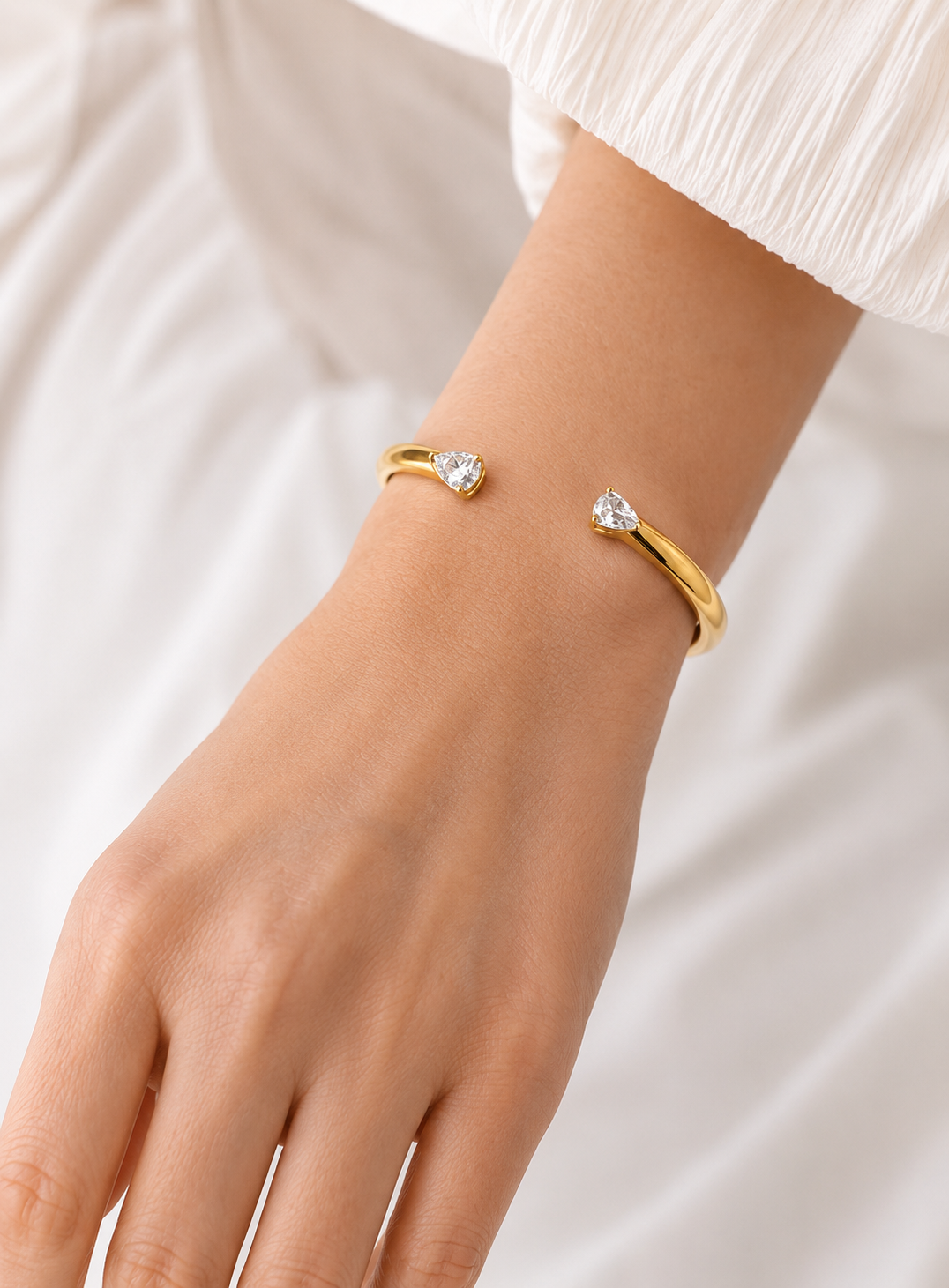 Elegant Gold Open Cuff Bangle with Pear-Cut Crystal Ends