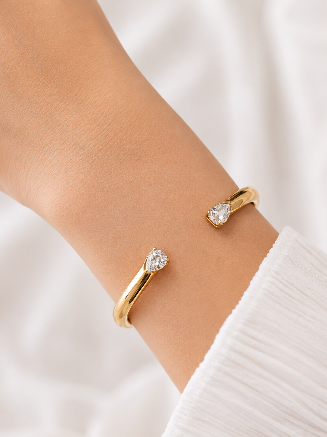 Elegant Gold Open Cuff Bangle with Pear-Cut Crystal Ends