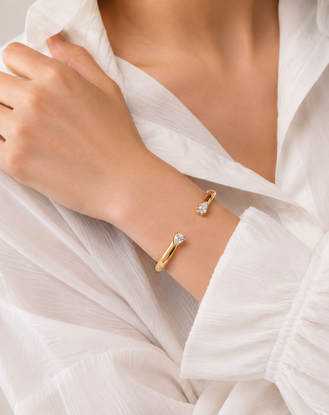 Elegant Gold Open Cuff Bangle with Pear-Cut Crystal Ends